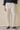 Pantalones Gurkha plisados color crema para hombre, cintura ajustable, corte entallado.