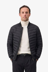 Chaqueta bomber acolchada ligera con cremallera para hombre, color negro.