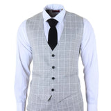 Traje de tres piezas gris para hombre, corte entallado, a cuadros.