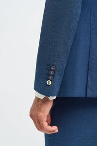 Traje de lino azul para hombre, ideal para verano.