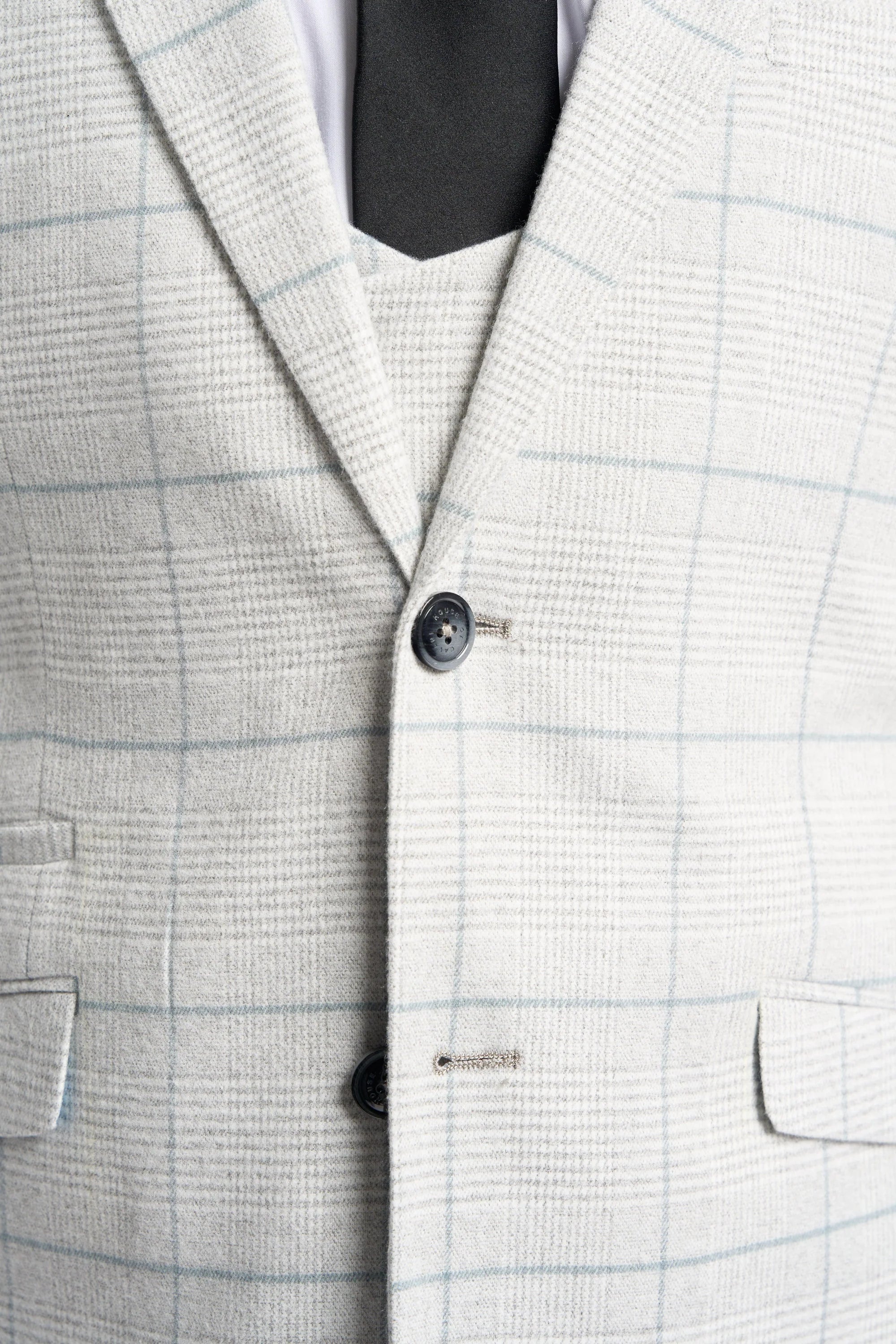 Traje de tres piezas a cuadros gris claro