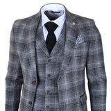 Traje de tres piezas para hombre de tweed gris a cuadros.
