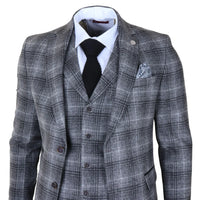 Traje de tres piezas para hombre de tweed gris a cuadros.