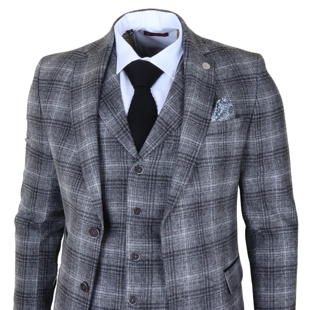 Traje de tres piezas para hombre de tweed gris a cuadros.