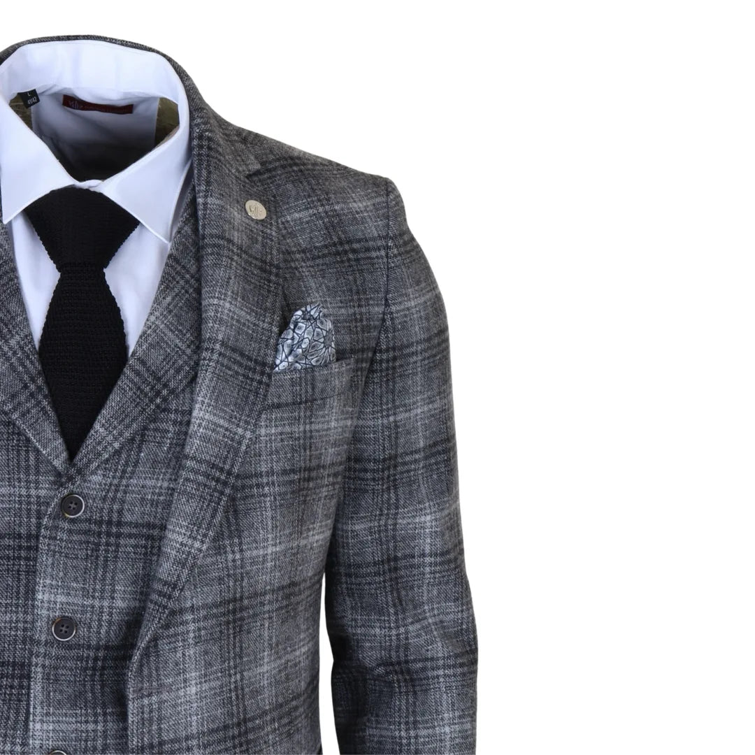 Traje de tres piezas para hombre de tweed gris a cuadros.