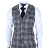 Traje de tres piezas para hombre de tweed gris a cuadros.