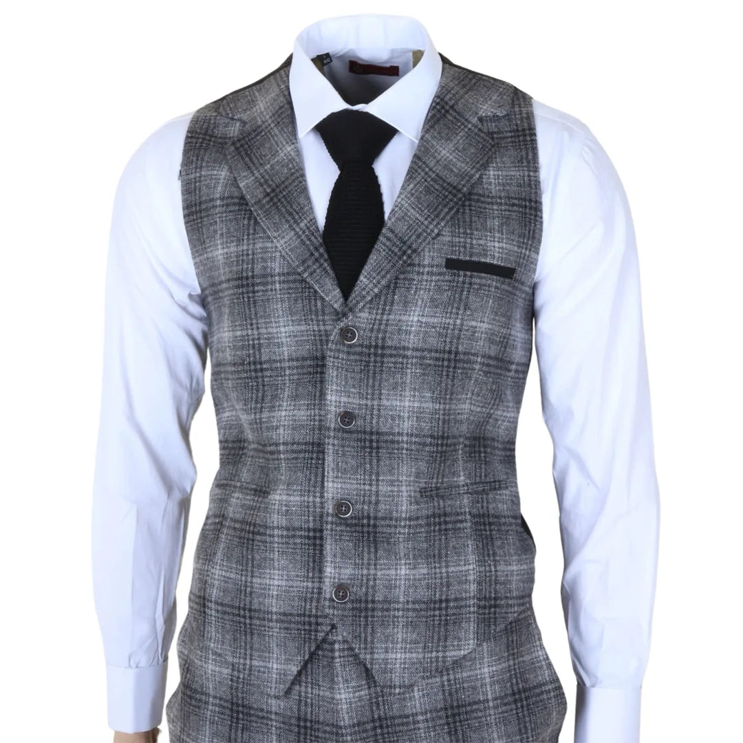 Traje de tres piezas para hombre de tweed gris a cuadros.