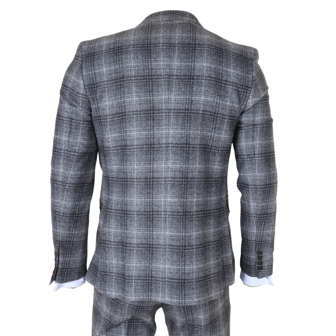 Traje de tres piezas para hombre de tweed gris a cuadros.