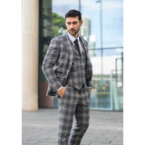 Traje de tres piezas para hombre de tweed gris a cuadros.