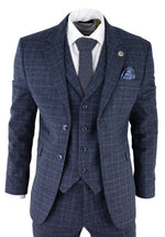 Traje de tres piezas para hombre con estampado de cuadros escoceses azules.