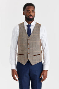Traje azul marino Arthur con chaleco de tweed marrón de Harris en contraste.