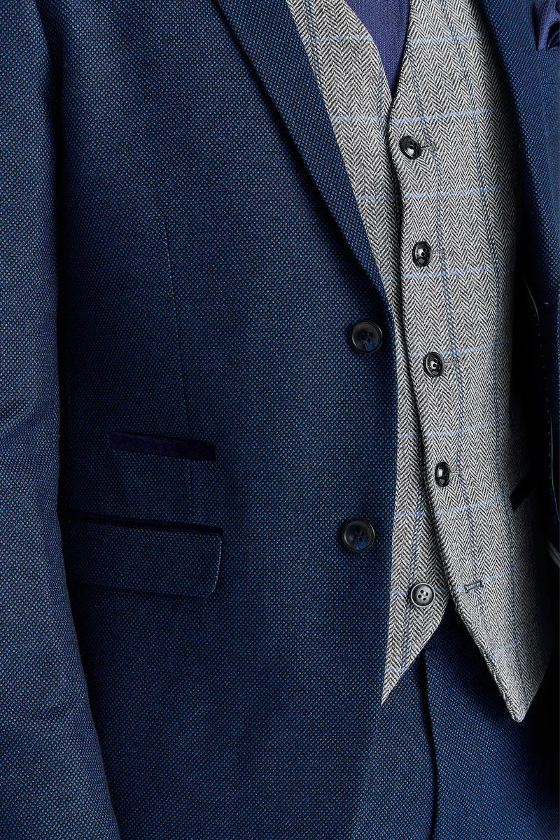 Traje azul marino Arthur con chaleco de tweed gris Harris en contraste.