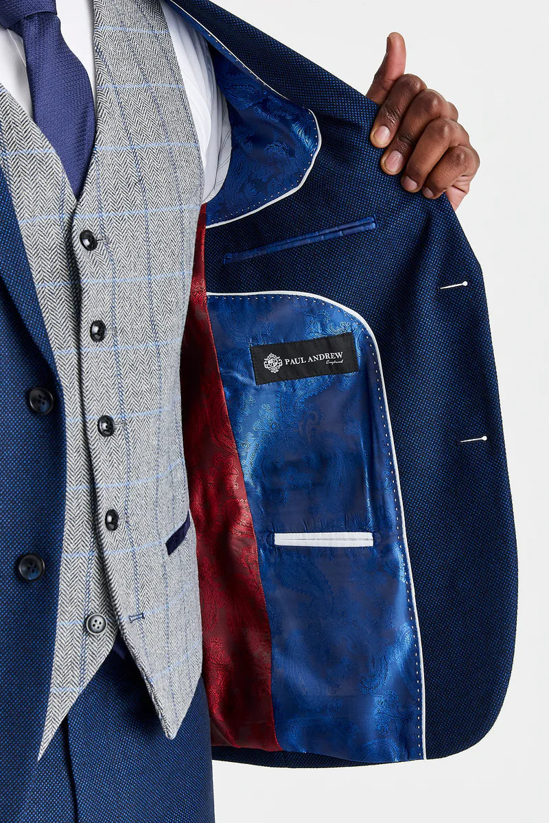 Traje azul marino Arthur con chaleco de tweed gris Harris en contraste.