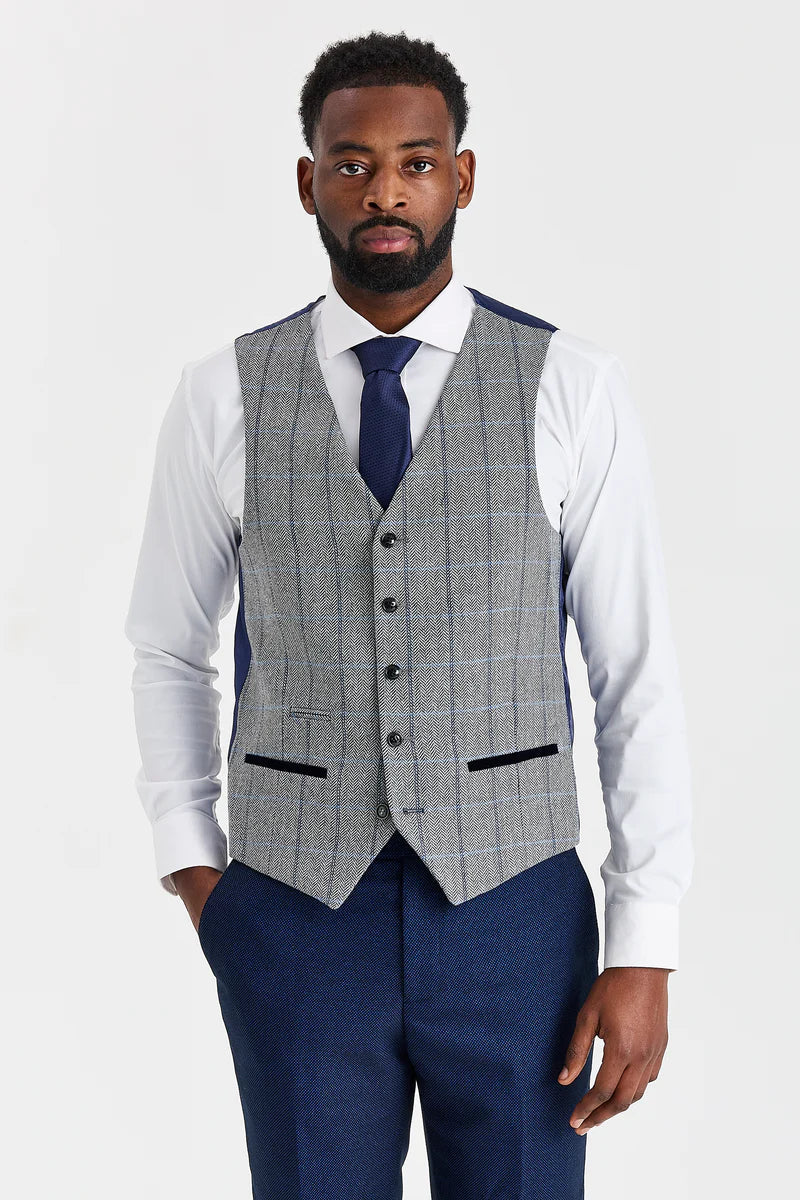 Traje azul marino Arthur con chaleco de tweed gris Harris en contraste.