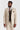 Traje Belmont color beige con chaleco de tweed verde Harris.
