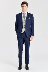 Traje azul marino Belmont con chaleco Belmont color verde salvia en contraste.