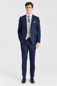 Traje azul marino Belmont con chaleco Belmont color verde salvia en contraste.