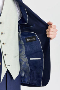 Traje azul marino Belmont con chaleco Belmont color verde salvia en contraste.