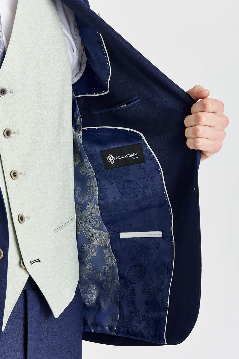 Traje azul marino Belmont con chaleco Belmont color verde salvia en contraste.