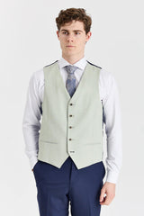 Traje azul marino Belmont con chaleco Belmont color verde salvia en contraste.