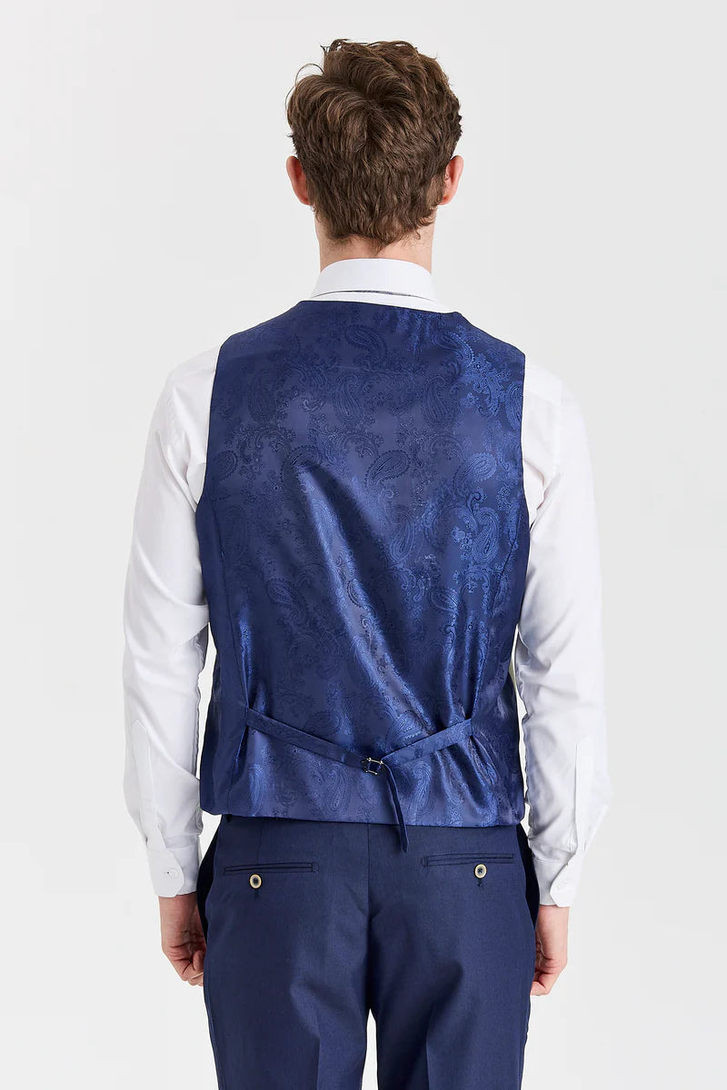 Traje azul marino Belmont con chaleco Belmont color verde salvia en contraste.