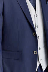 Traje azul marino Belmont con chaleco plateado Belmont en contraste.
