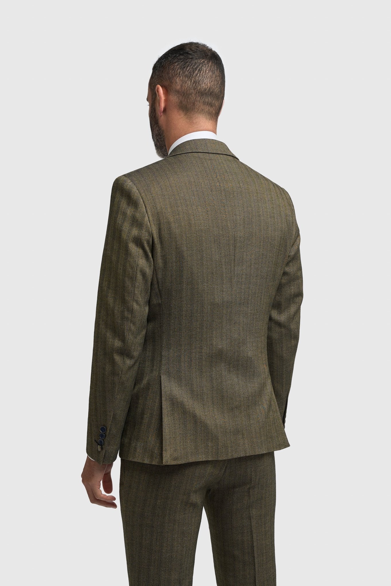 Traje de hombre de tres piezas de tweed con estampado de espiga en color verde oliva