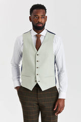 Traje de tweed a cuadros verde Harris con chaleco Belmont color verde salvia en contraste.