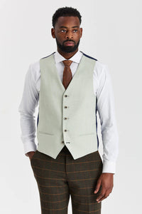 Traje de tweed a cuadros verde Harris con chaleco Belmont color verde salvia en contraste.