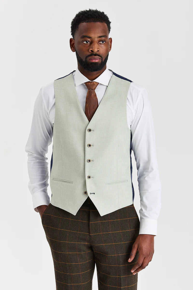 Traje de tweed a cuadros verde Harris con chaleco Belmont color verde salvia en contraste.