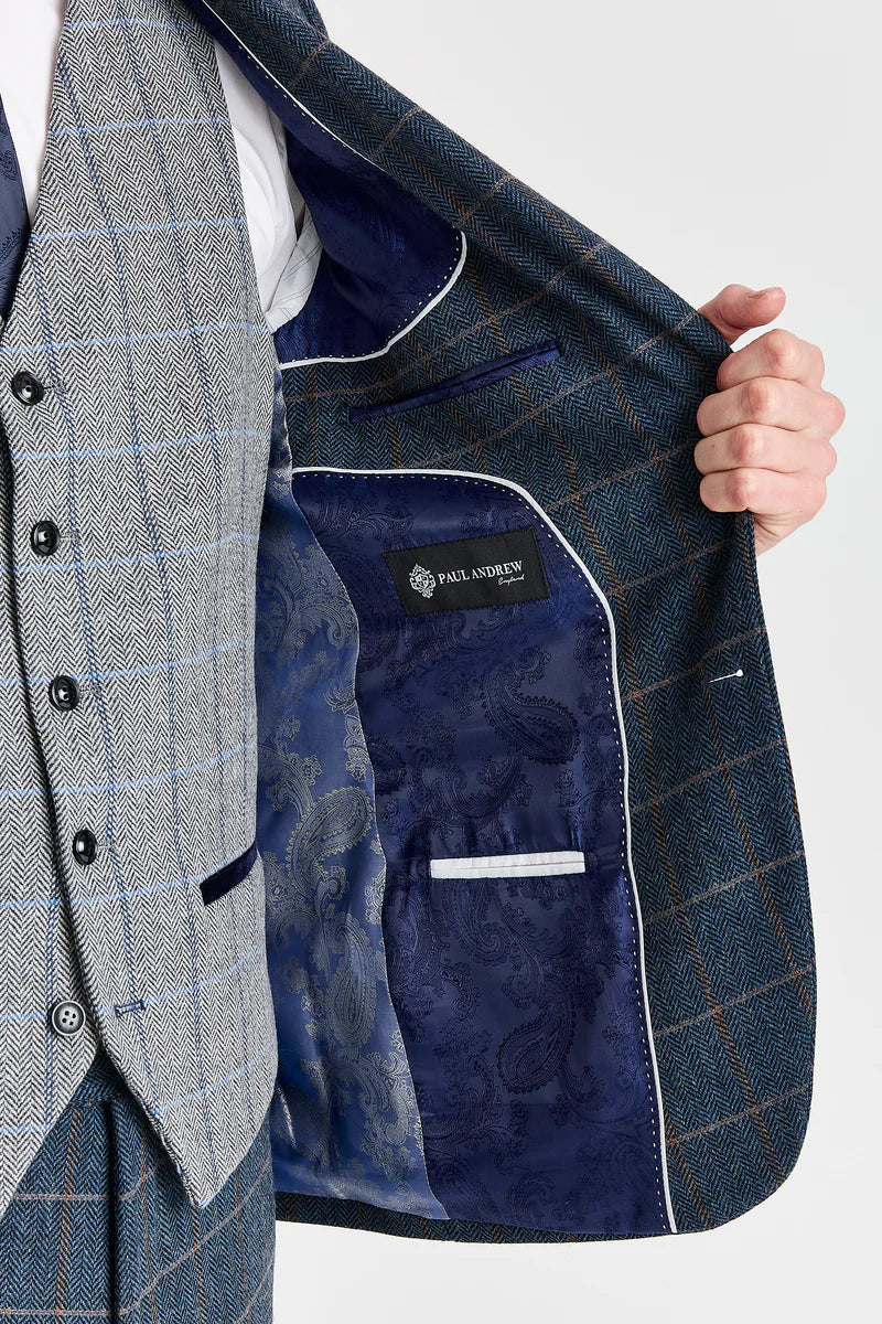 Traje de tweed azul marino de Harris con chaleco de tweed gris de Harris en contraste.