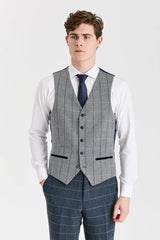 Traje de tweed azul marino de Harris con chaleco de tweed gris de Harris en contraste.