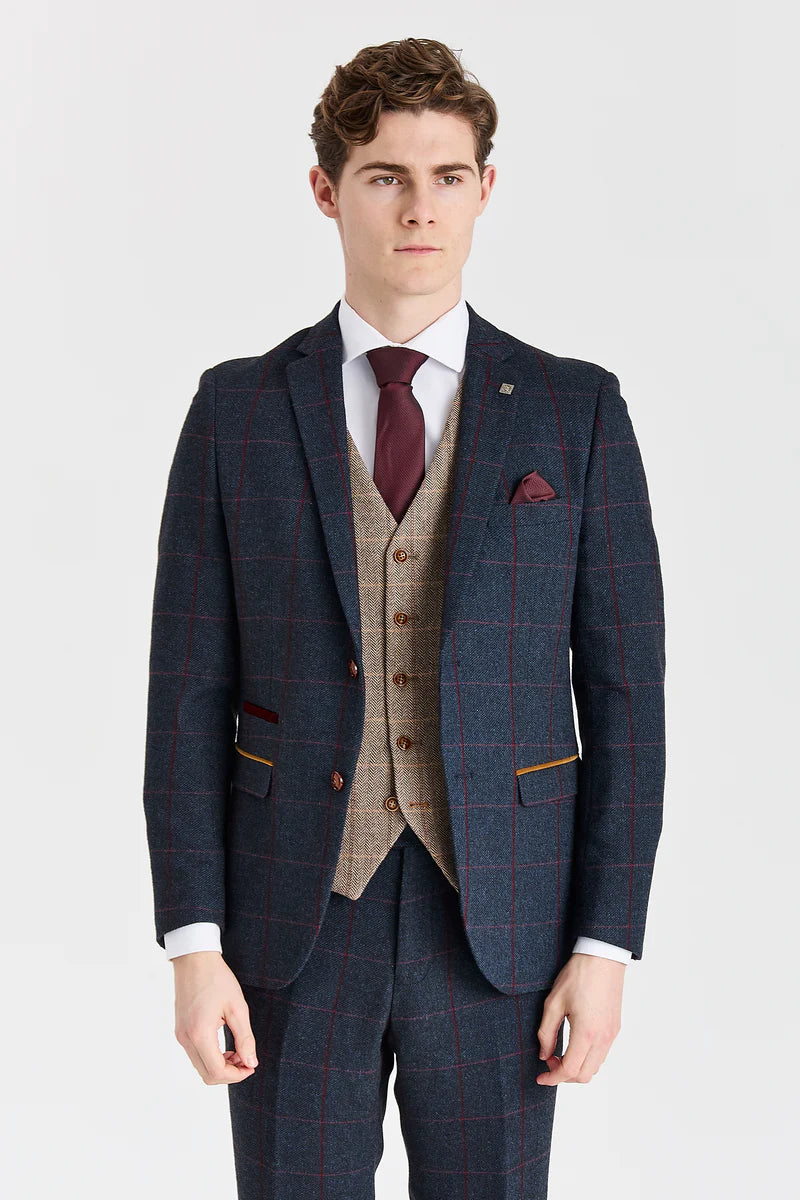 Traje azul marino Madrid con chaleco de tweed marrón Harris en contraste.