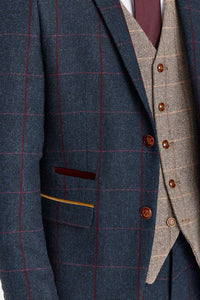 Traje azul marino Madrid con chaleco de tweed marrón Harris en contraste.