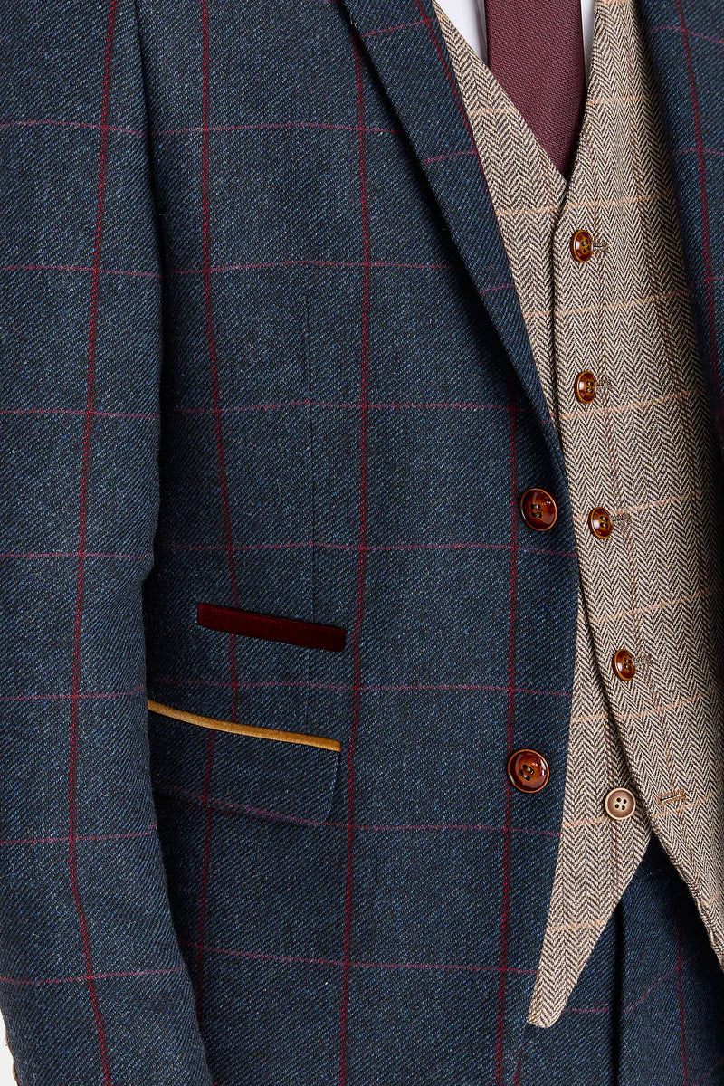 Traje azul marino Madrid con chaleco de tweed marrón Harris en contraste.