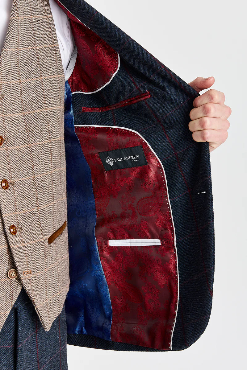 Traje azul marino Madrid con chaleco de tweed marrón Harris en contraste.