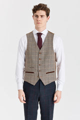 Traje azul marino Madrid con chaleco de tweed marrón Harris en contraste.