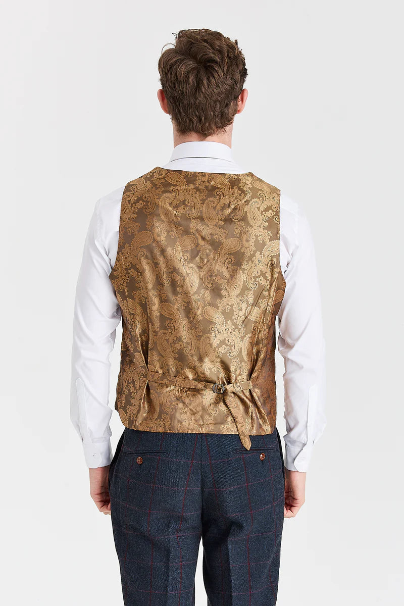 Traje azul marino Madrid con chaleco de tweed marrón Harris en contraste.