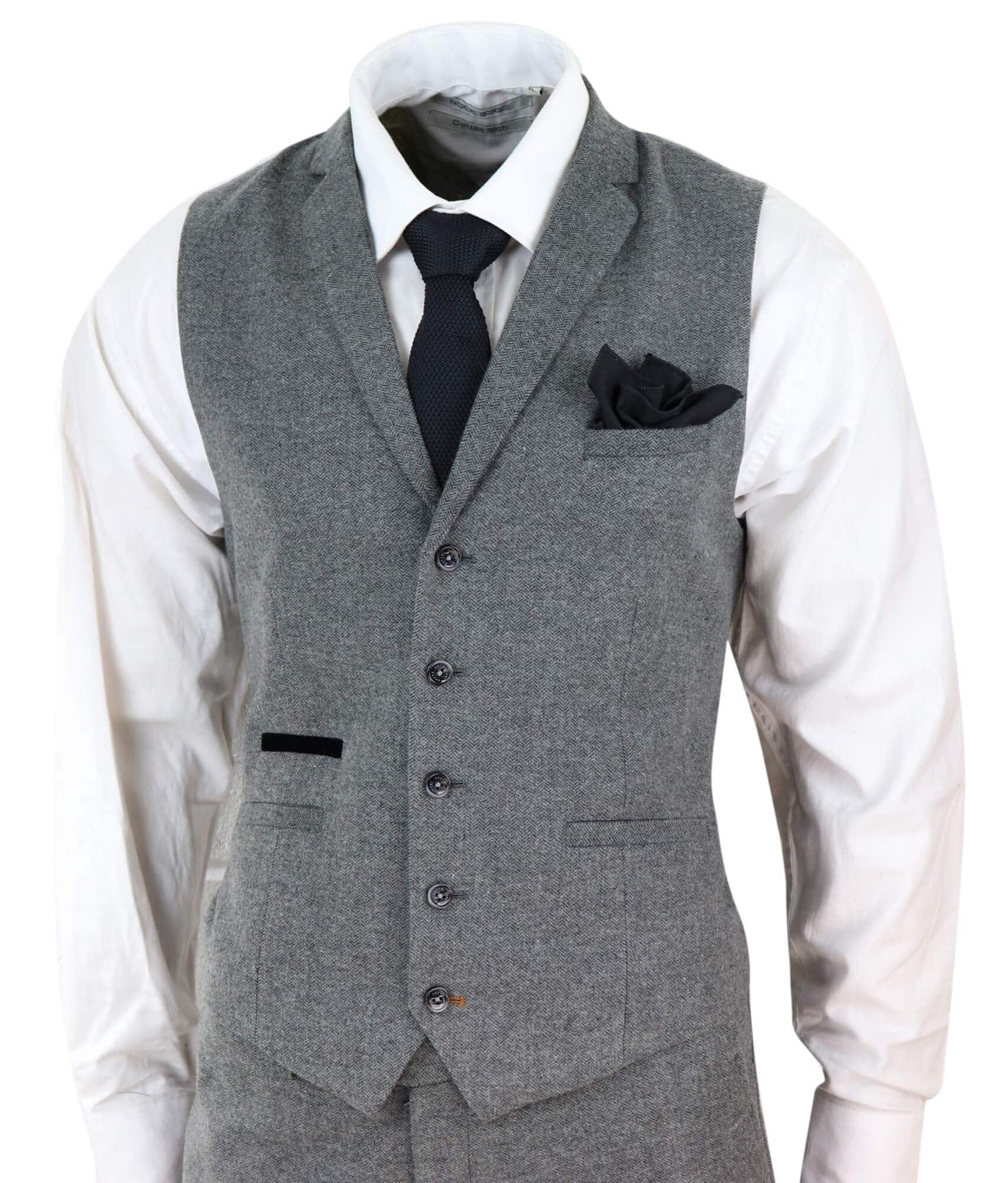 Traje de tres piezas para hombre de tweed gris oscuro con estampado de espiga.