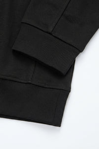 Sudadera negra de hombre con cremallera de un cuarto, mezcla de algodón y cuello alto.
