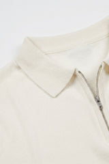 Polo de punto color blanco roto para hombre, cuello con cremallera, mezcla suave, manga corta.