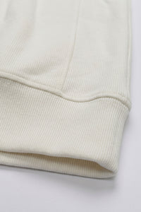 Sudadera de hombre color blanco roto con cremallera de un cuarto, mezcla de algodón y cuello alto.