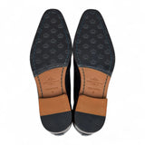 Zapatos de hombre clásicos de cuero negro con cordones, estilo brogue.