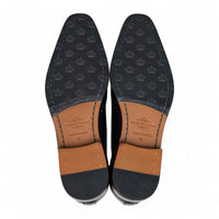 Zapatos de hombre clásicos de cuero negro con cordones, estilo brogue.