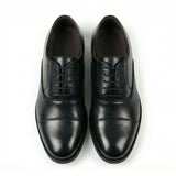 Zapatos Oxford clásicos de hombre con puntera reforzada y cordones.