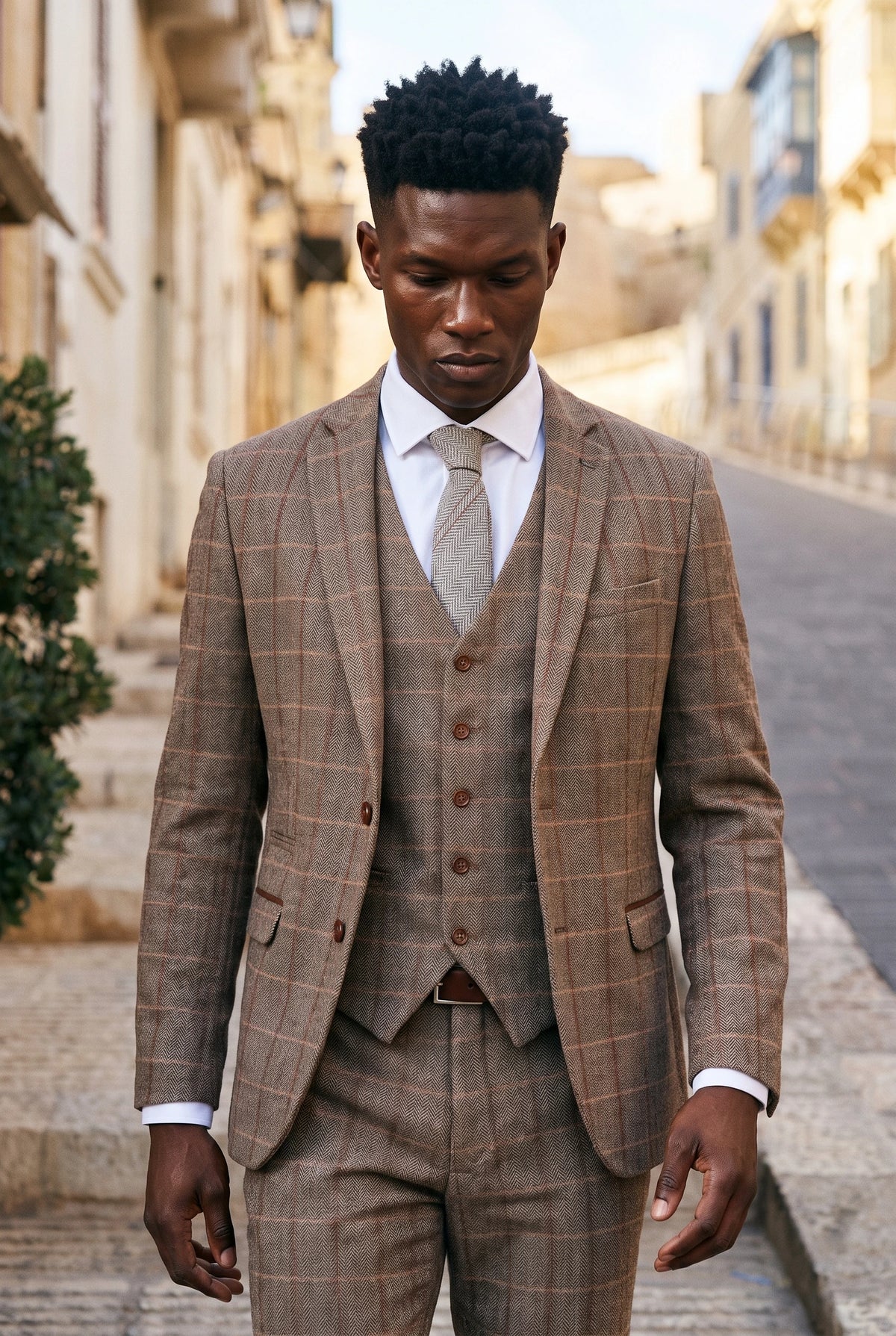Corbata de hombre de tweed de lana gris con estampado de espiga.