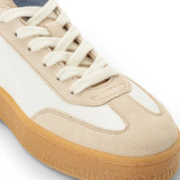 Zapatillas deportivas de hombre de piel color blanco roto con raya roja