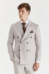 Blazer cruzado para hombre color piedra con estampado de ojo de pájaro.