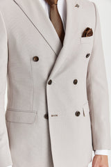 Blazer cruzado para hombre color piedra con estampado de ojo de pájaro.