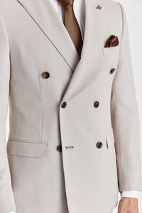 Blazer cruzado para hombre color piedra con estampado de ojo de pájaro.